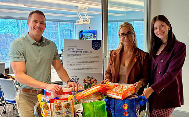Three First American colleagues with donations.