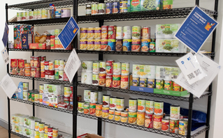 First American colleagues organize food donations at a local non profit