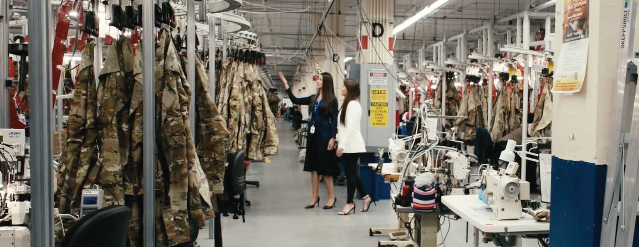 First American and Goodwill colleague in manufacturing facility.