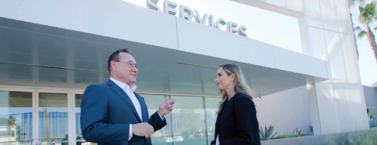 First American colleague with Pacific Dental Services outside of building