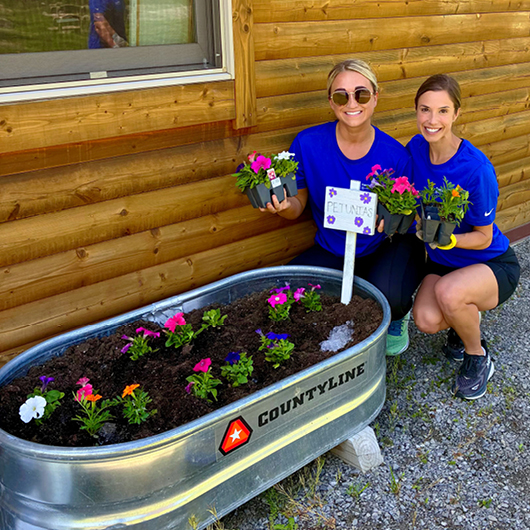 First American colleagues planting flowers