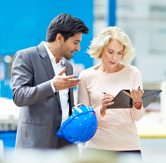 Women and man collaborating on tablet