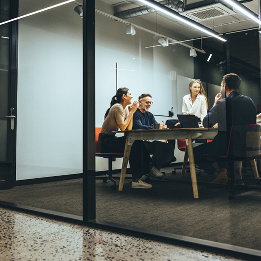 Team collaborating in modern conference room