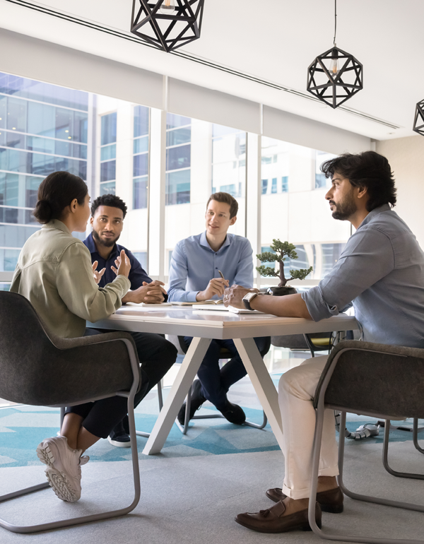 Team collaborating around a conference table.