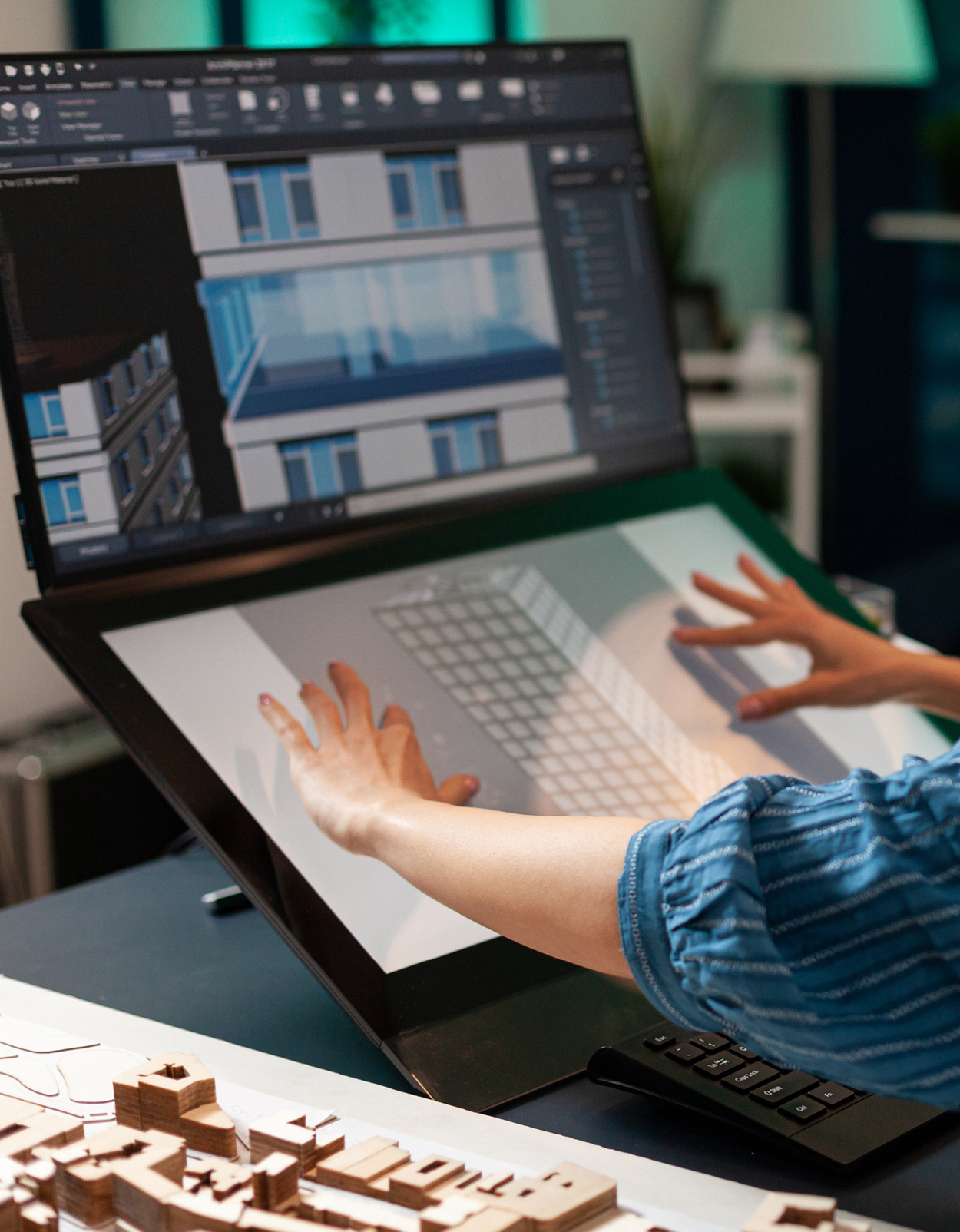 Professional woman architect working on building plan using modern technology equipment touchpad monitor screen computer. 