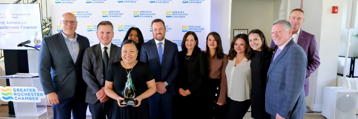 Group photo of award recipients and attendees at a Greater Rochester Chamber event.