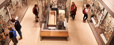 Overhead view of busy museum interior with visitors