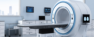A modern MRI scanner in a well-lit medical imaging room.