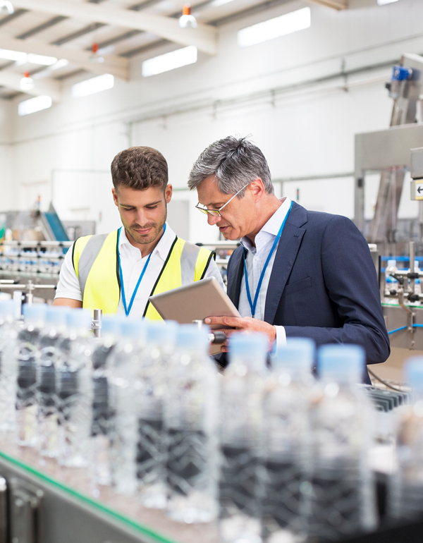 Workers in a food and beverage manufacturing plant