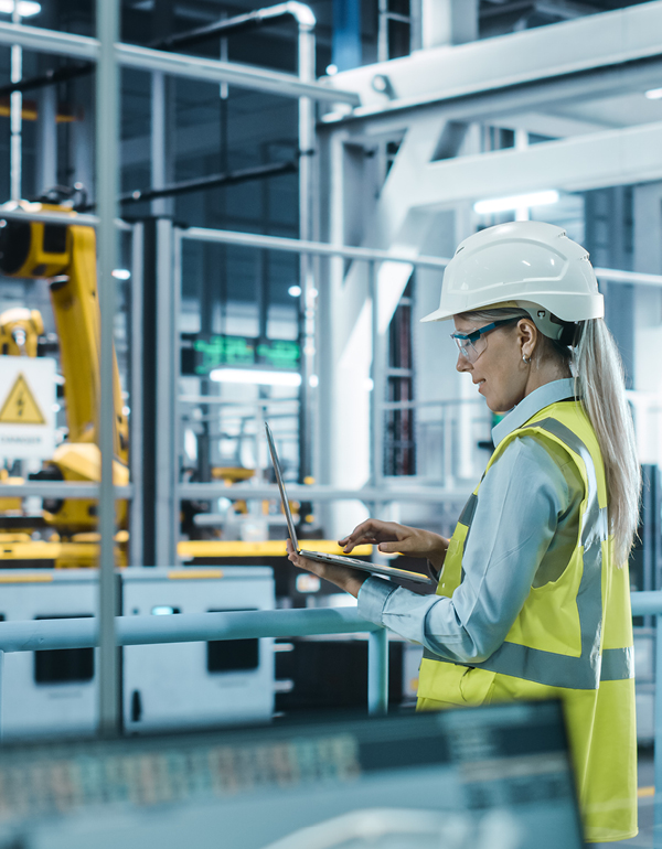 Worker in an automated manufacturing warehouse